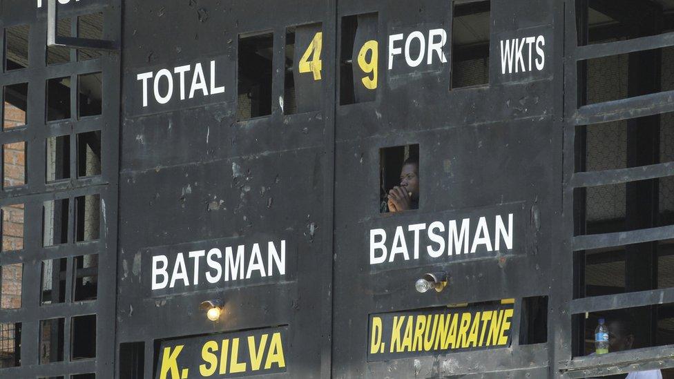 A cricket scoreboard operator in Harare, Zimbabwe - Sunday 6 November 2016