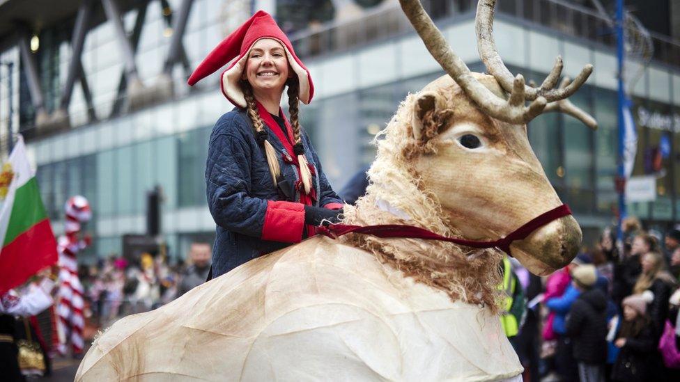 Woman riding reindeer in Manchester Christmas Parade