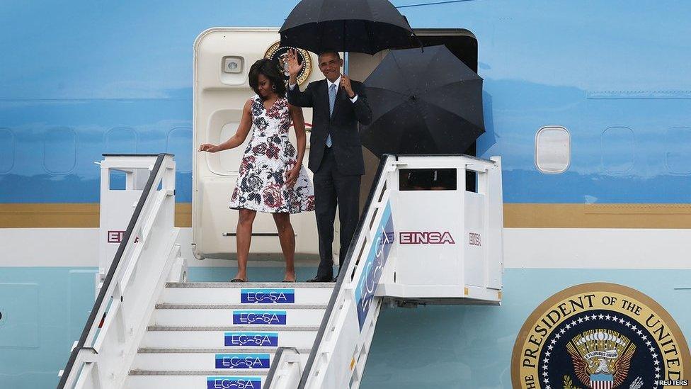 US President Barack Obama and his wife Michelle exit Air Force One