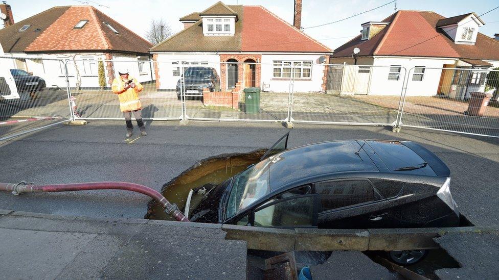 A car in a sinkhole in Brentwood