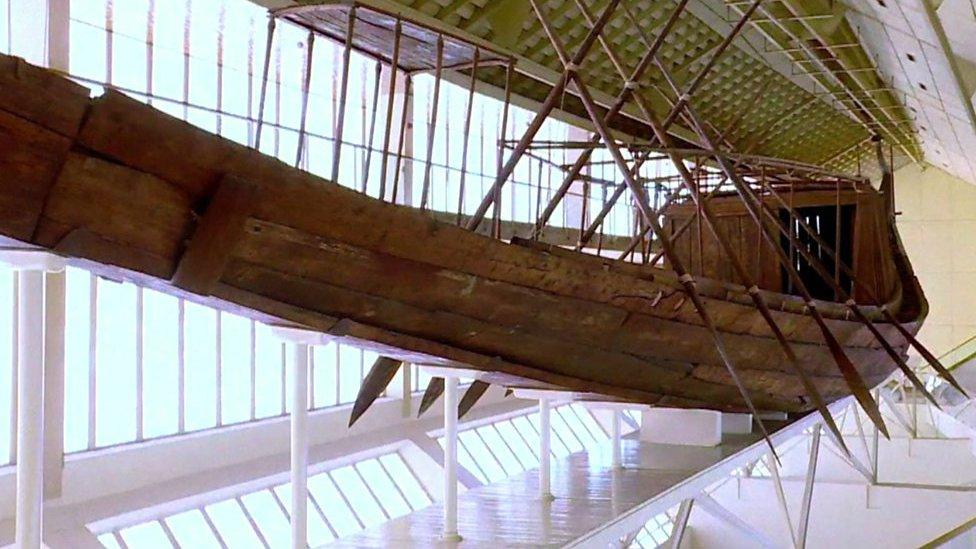 A restored boat that was one of a pair buried in pits next to Pharaoh Khufu final resting place