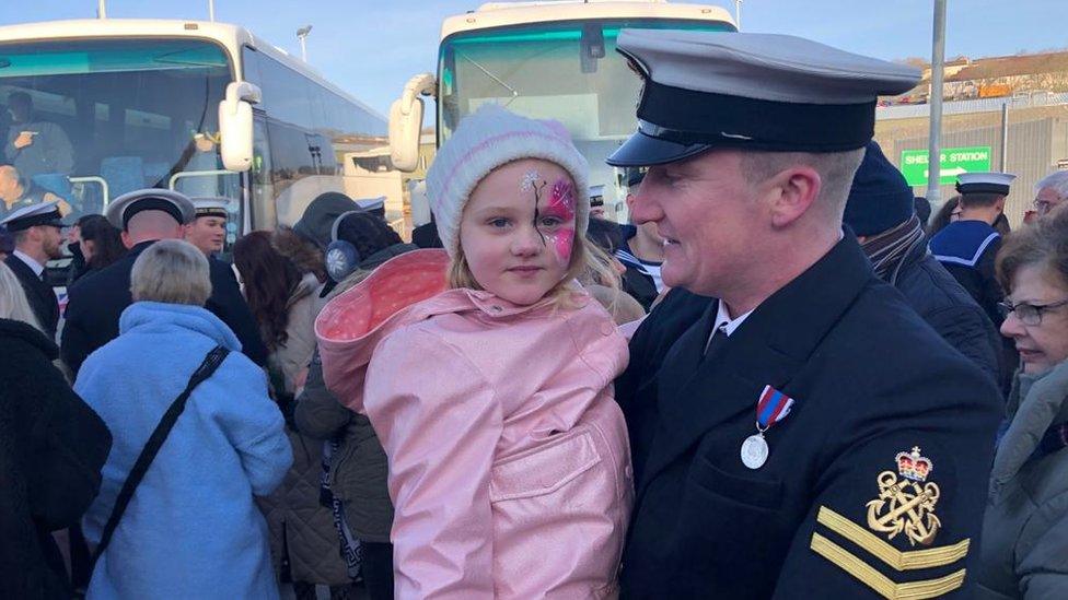 Families in Devonport at the homecoming of HMS Montrose