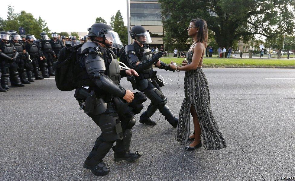 A demonstrator protesting at the shooting death of Alton Sterling is detained by law enforcement near the headquarters of the Baton Rouge Police Department in Baton Rouge, Louisiana, US July 9, 2016