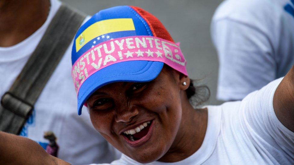 A supporter of Venezuelan President Nicolas Maduro cheers during the closing of the campaign to elect the members of a Constituent Assembly that would rewrite the constitution, in Caracas on July 27, 2017