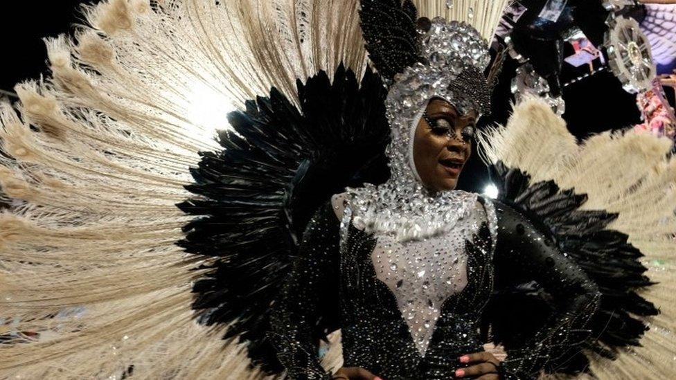 Performer from the Mangueira samba school parades during carnival celebrations at the Sambadrome in Rio de Janeiro, Brazil, Tuesday, Feb. 9, 2016