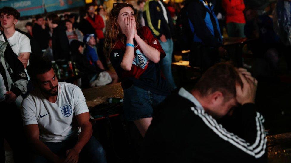 Fans look on in disbelief as England fail to make a penalty