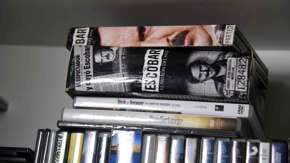 View of books and DVDs at Brazilian drug trafficker Jarvis Chimenes Pavao"s cell at Tacumbu prison in Asuncion on July 28, 2016