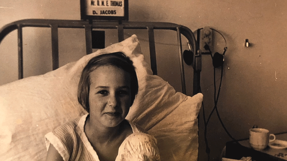 Young Susan Payne in her hospital bed