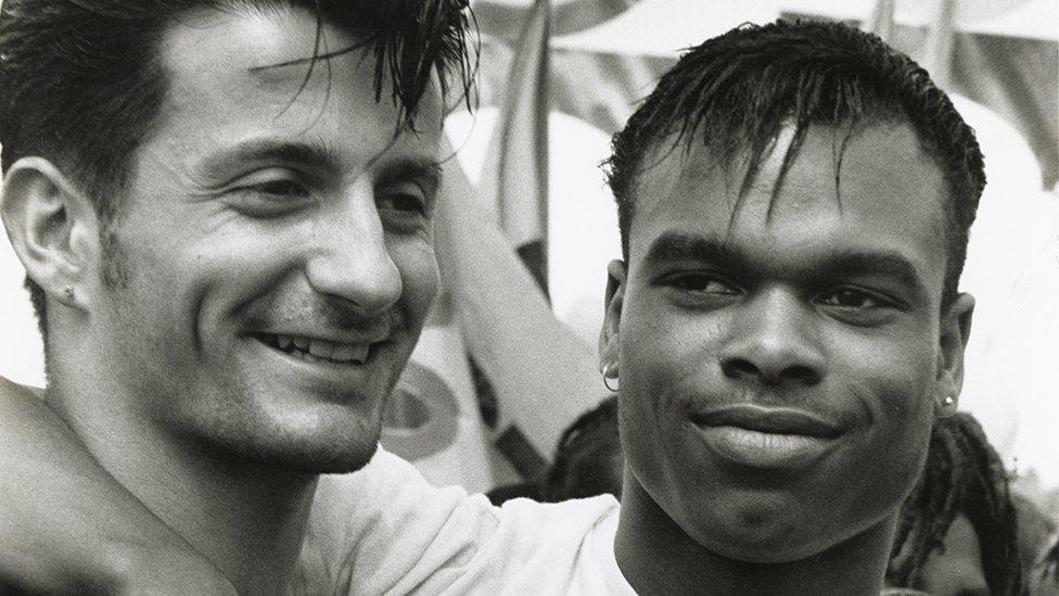 Two men attend a Pride march in 1988