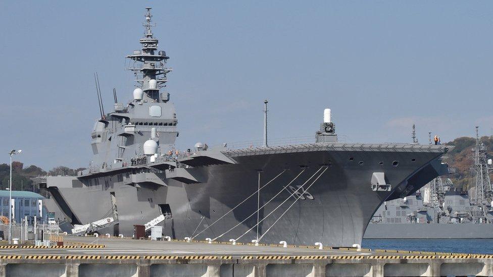 This picture taken on 6 December 2016 shows the helicopter carrier Izumo at a berth in its Yokosuka Base in Kanagawa prefecture