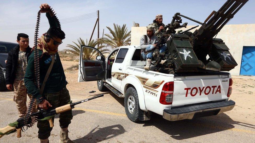 Members of forces loyal to Libya's Islamist-backed parliament General National Congress (GNC) prepare to launch attacks as they continue to fight Islamic State (IS) group jihadists on the outskirts of Libya's western city of Sirte on March 16, 2015