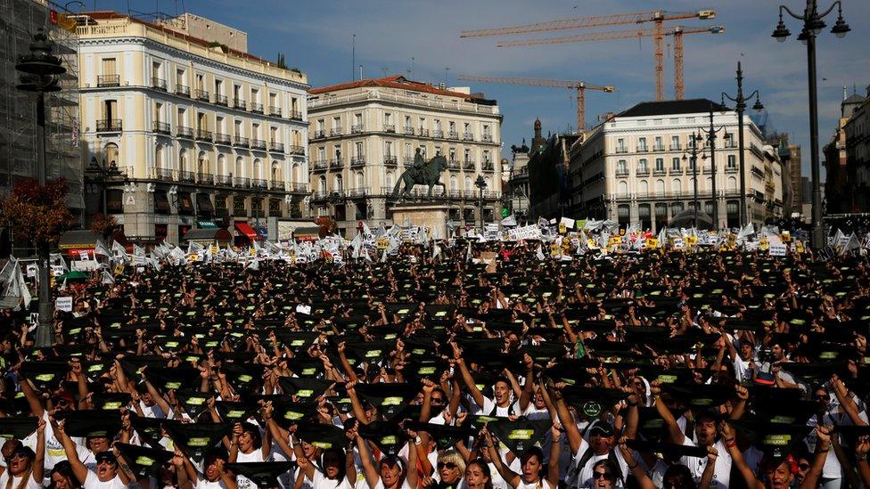 Animal rights activists hold black neckties at the start of a demonstration to demand a ban on bullfighting in Madrid