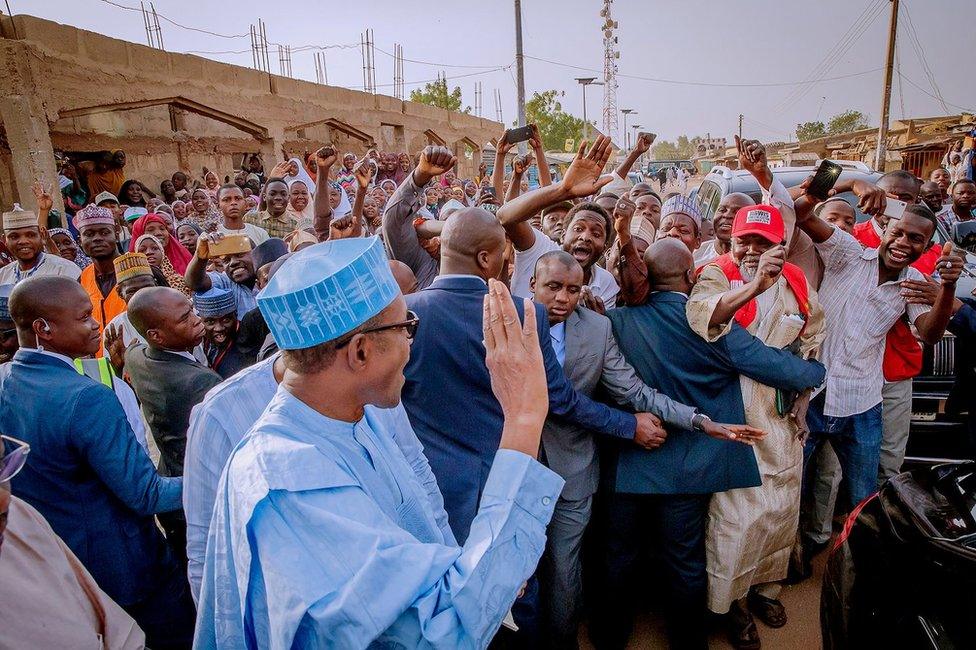 Buhari waves to crowd after voting