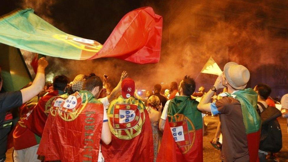 Portugal fans celebrate at the Champs Elysees in Paris