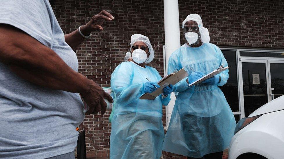 Medical workers prepare to vaccinate people at a pop-up COVID-19 vaccination clinic in a rural Delta community on April 29, 2021