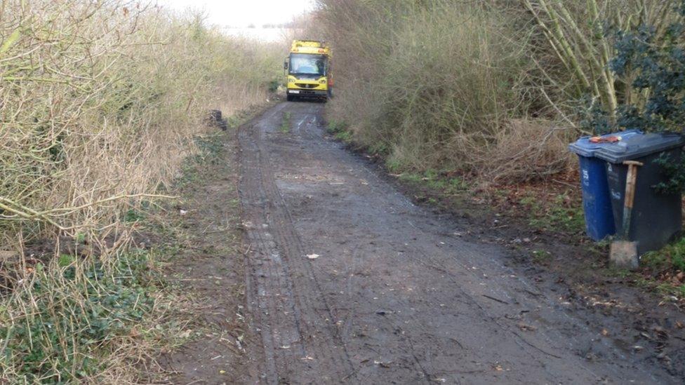 Lorry driving down a cleared bridleway