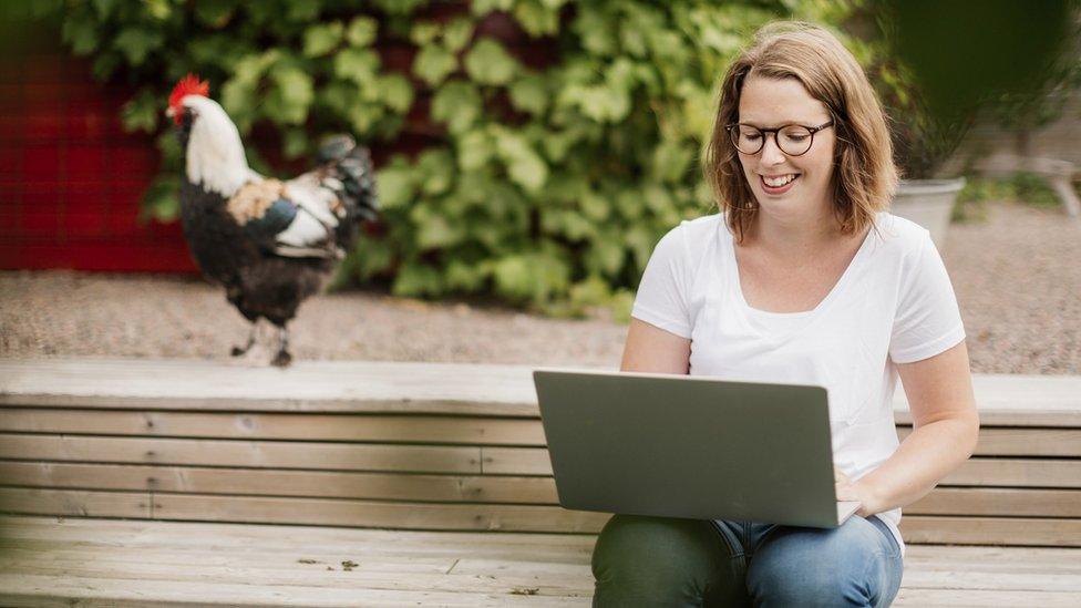 Woman works from home in the countryside