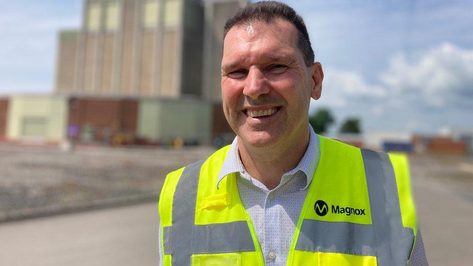 Berkeley site director Chris Burden wearing a hi vis jacket smiling into the camera