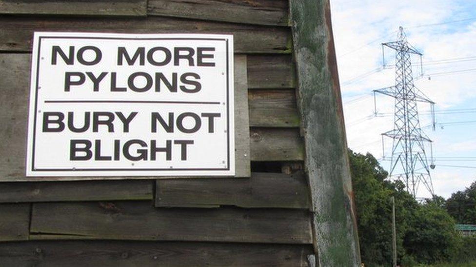 Anti-pylons sign, with pylon in background