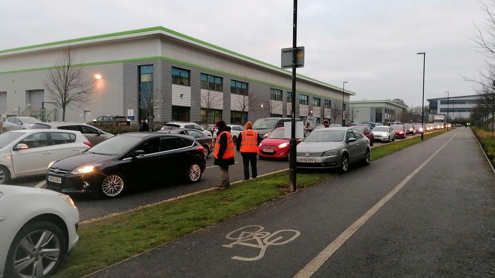 A queue of traffic builds up from the entrance to the Amazon Coventry site and along Sayer Drive to Coundon Wedge Drive