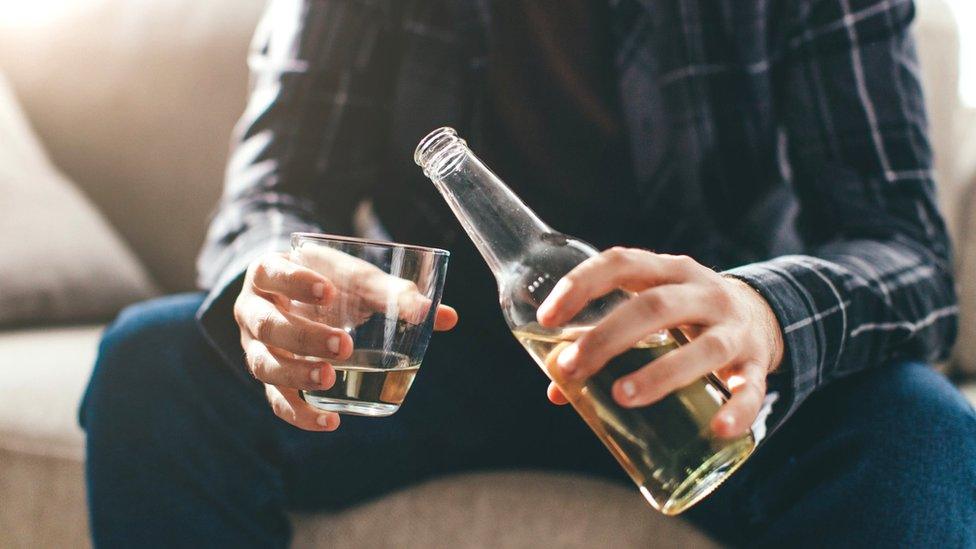 Man at home with beer