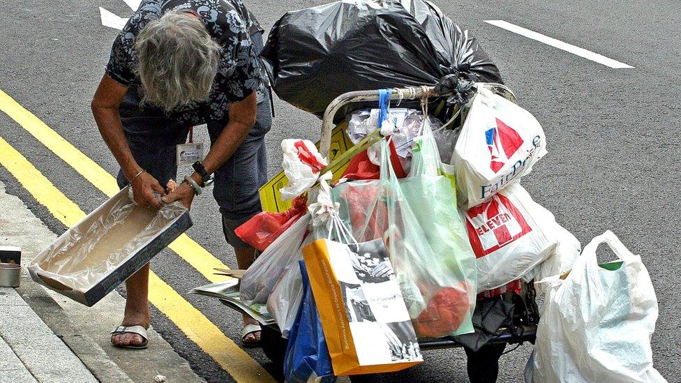 Woman cart waste collection Singapore