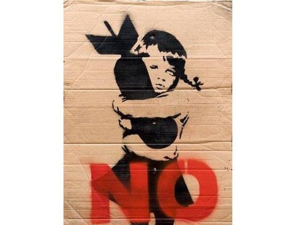 banksy placard