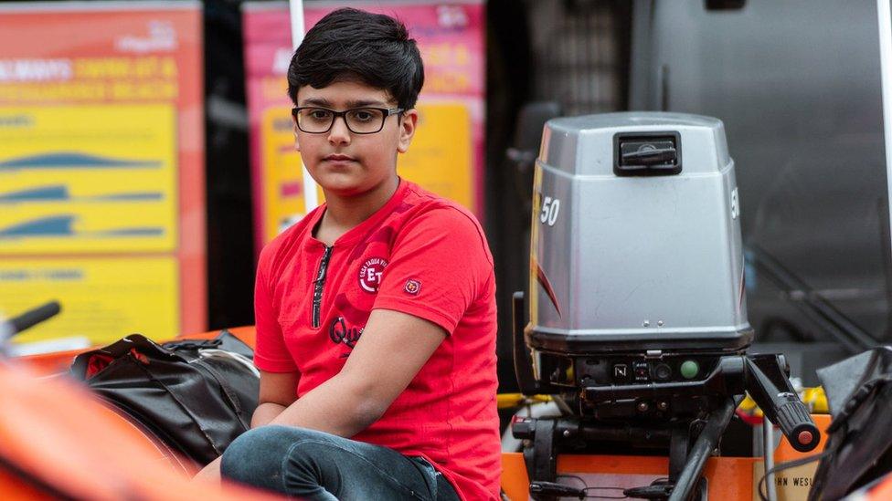 Ravi sitting in a lifeboat