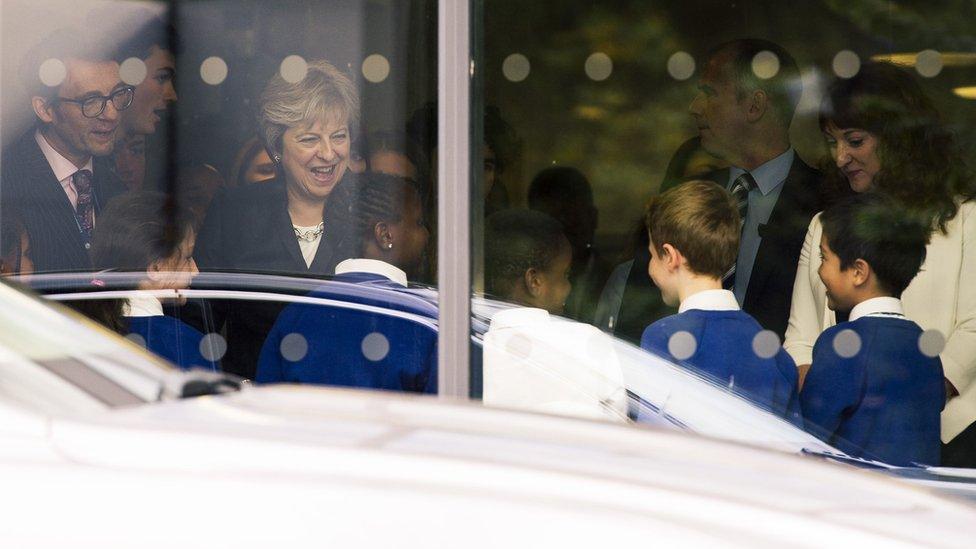 Prime Minister Theresa May talks to primary pupils during a visit to the Dunraven School in Streatham, south London, ahead of the publication of details of the Government's Race Disparity Audit