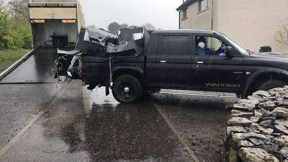 Cash machine in the back of a pick-up style truck