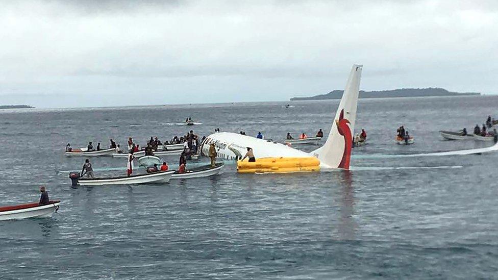 locals approaching to rescue passengers of the crashed Air Niugini aircraft on the remote Island of Weno