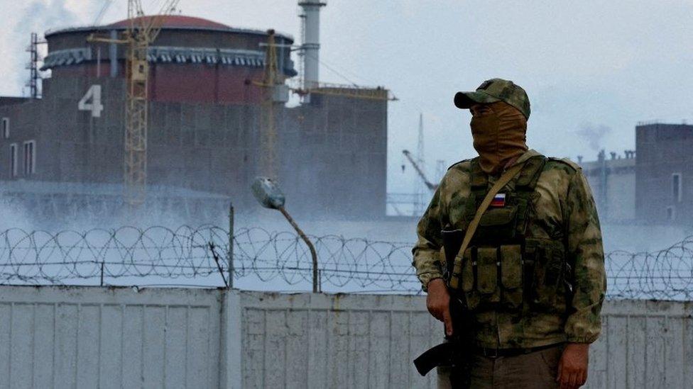 An armed Russian soldier guars near the Zaporizhzhia nuclear plant, southern Ukraine. Photo: August 2022