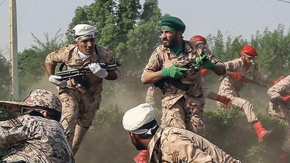 Soldiers run for cover during the attack