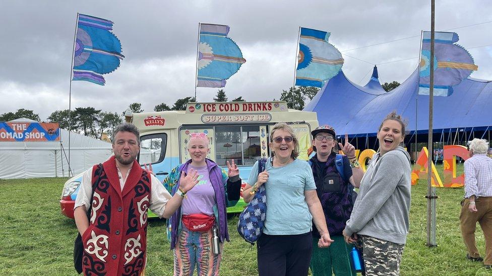 A group of revellers smiling at the camera