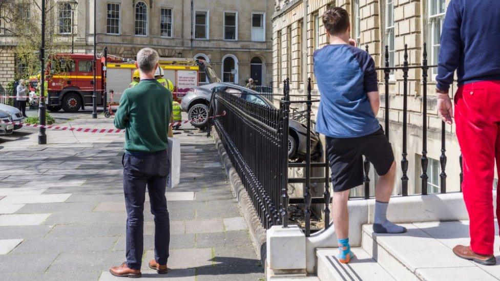 Bath car crashes through railings