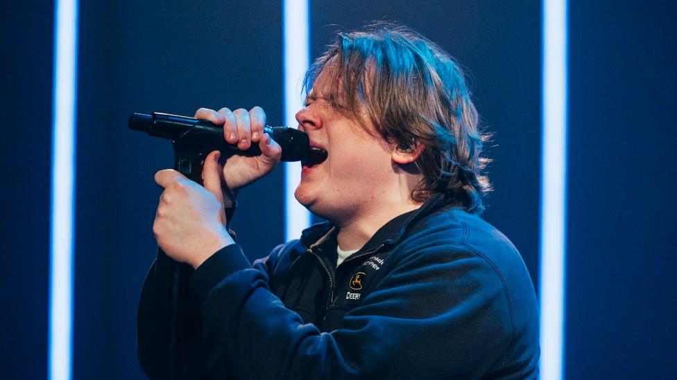 Lewis Capaldi performing on stage