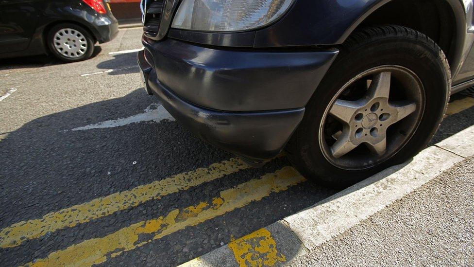 Car on yellow lines