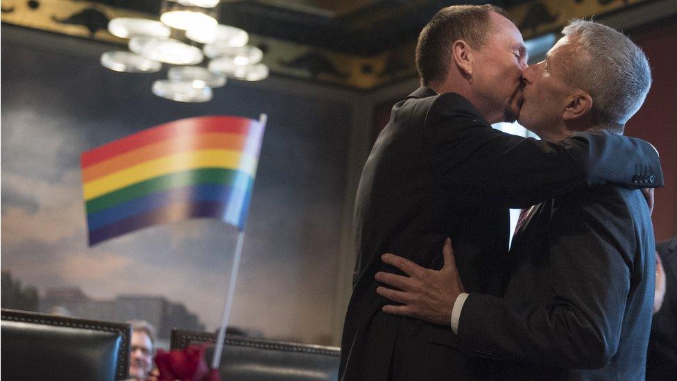 Karl Kreile and Bodo Mende kiss each other during their wedding in Berlin on 1 October 2017