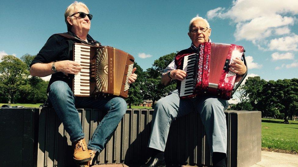 Phil Cunningham and Jim McColl playing accordions in Kay Park, Kilmarnock