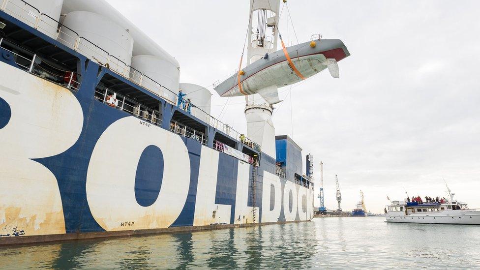 Maiden being lowered of cargo ship