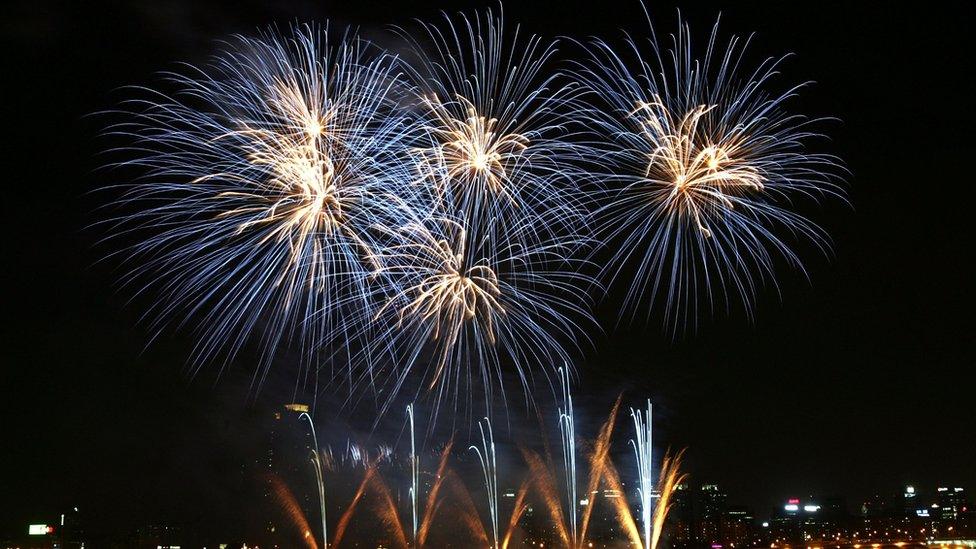 Fireworks illuminate the sky over downtown Seoul