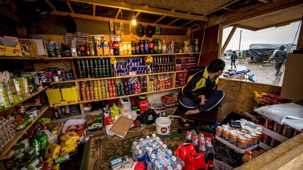 Some migrants have set up shops, cafes and restaurants as they wait to make the journey on from Calais