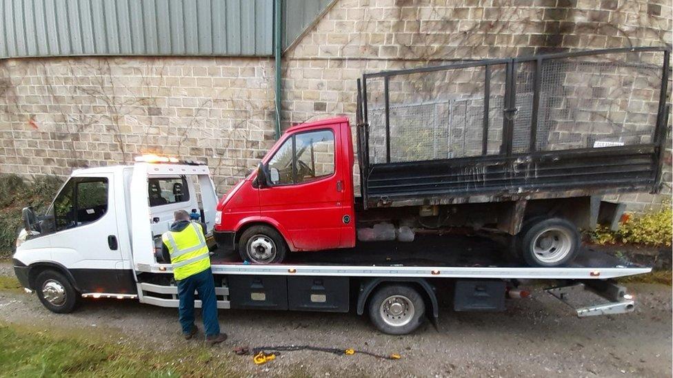 Van being towed away