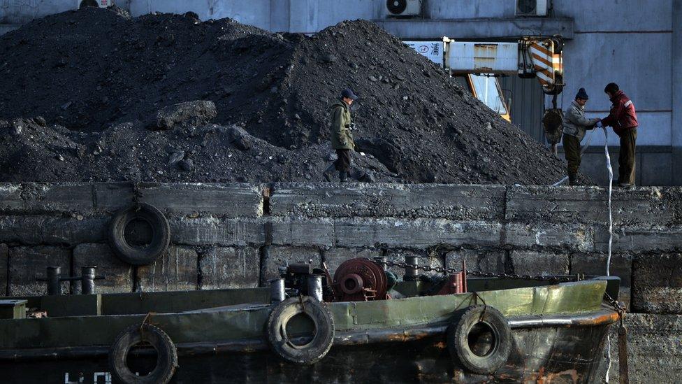 North Korean labourers work beside the Yalu River at the North Korean town of Sinuiju on February 8, 2013 which is close to the Chinese city of Dandong.