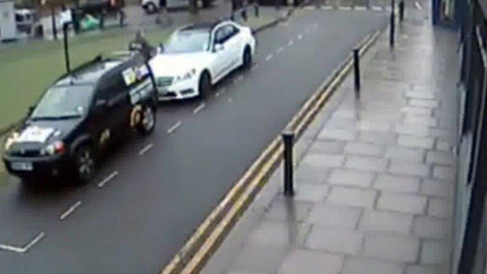 Hugh Doyle is pictured on CCTV standing by Kenny Collins' white Mercedes