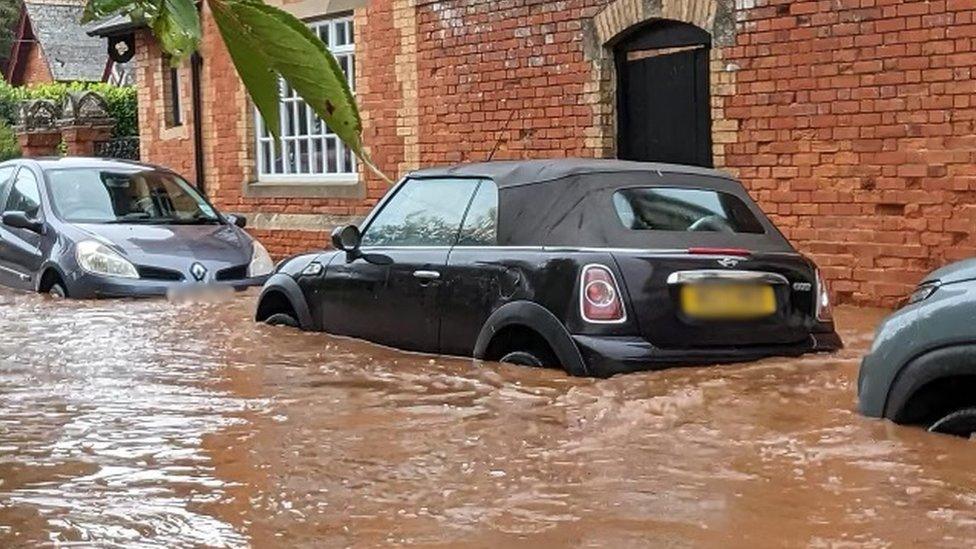 Cars covered in flood water