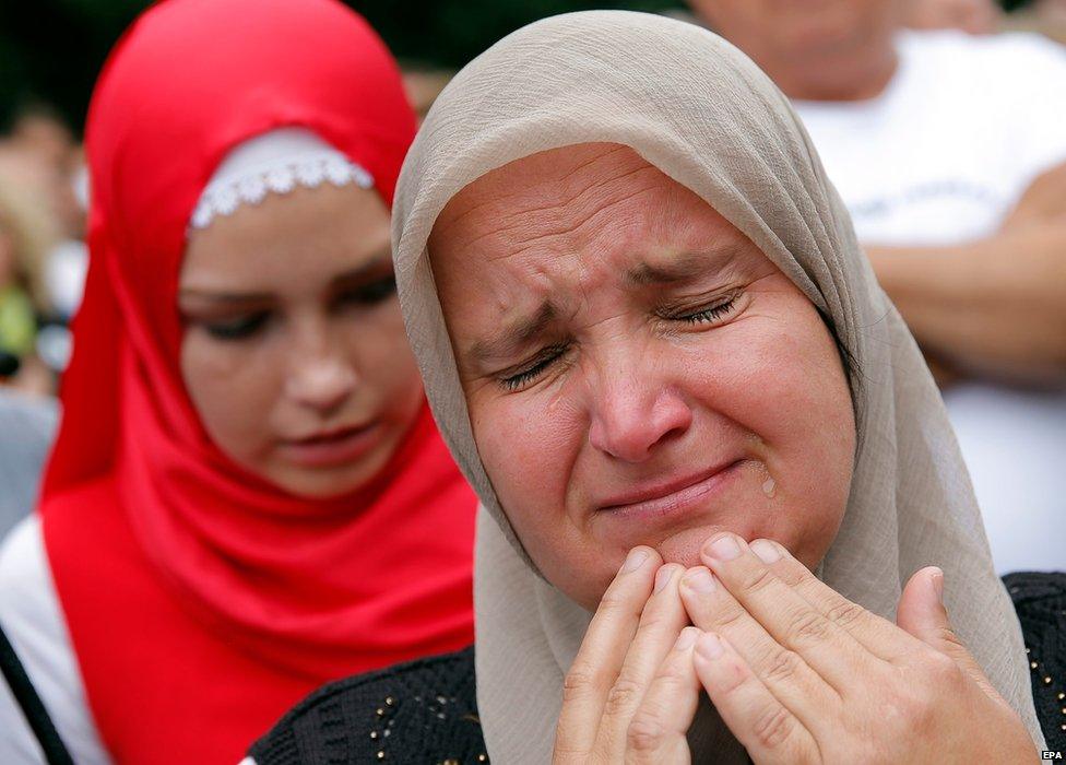 Bosnian women pay their last respects to the remains of 136 identified Bosnian Muslims ahead of a burial ceremony in Sarajevo, Bosnia and Herzegovina, 09 July 2015.