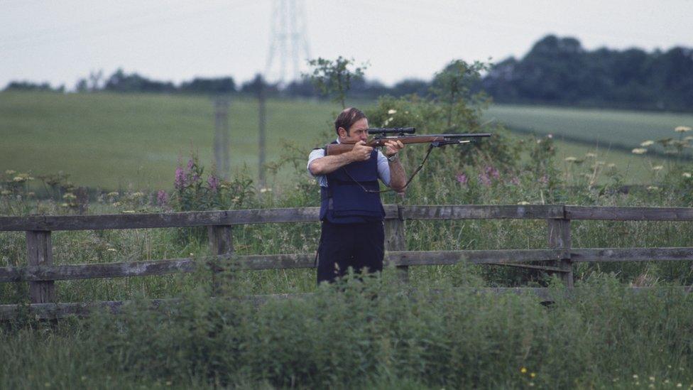 An officer searching for killer Barry Prudom during the manhunt in 1982