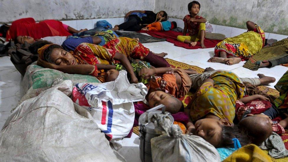 Bangladeshi villagers sleep in a cyclone shelter following an evacuation by authorities in the coastal villages of the Cox"s Bazar district on May 29, 2017 as Cyclone "Mora" gradually approaches towards the coastline