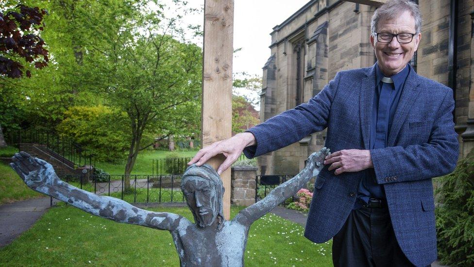 Reverend Canon Andrew Shipton with the crucifix